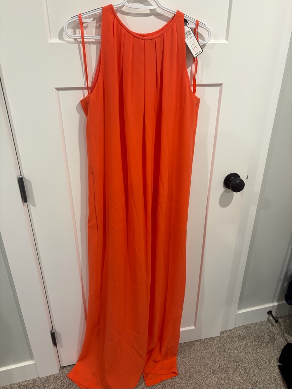 BCBGMaxAzria Coral Sleeveless Maxi Dress in a chiffon style.
